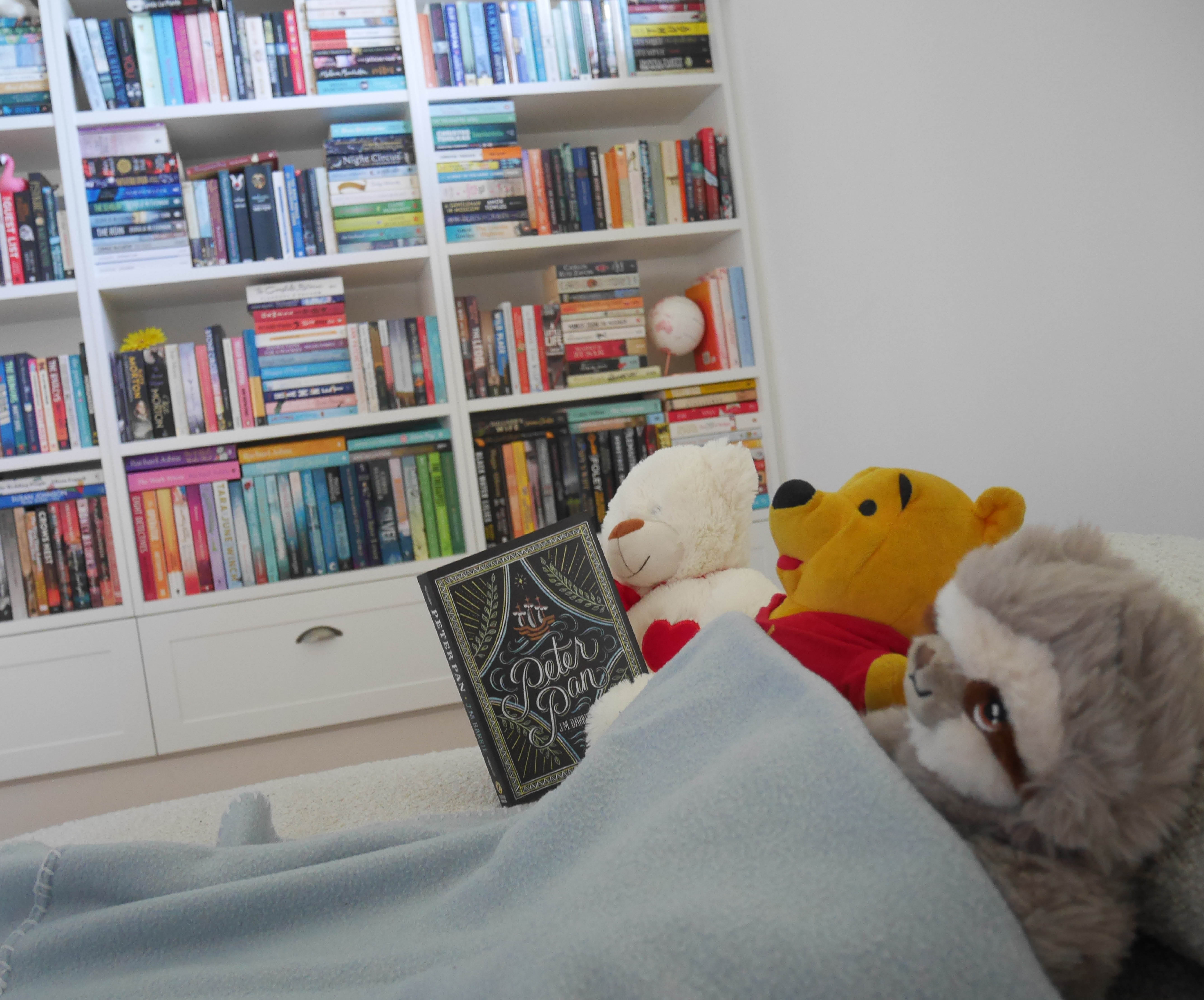 Pooh Bear reading Peter Pan to bear and sloth