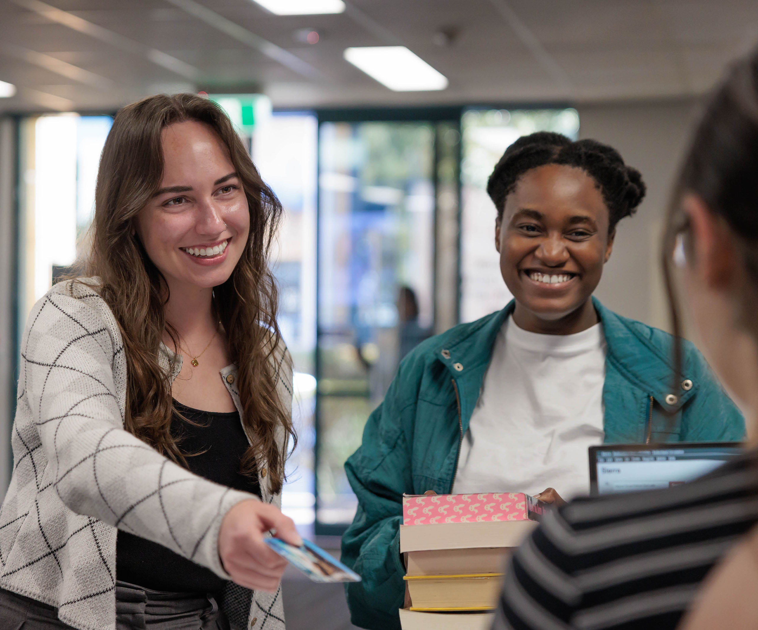 Two customers visiting Sutherland Library