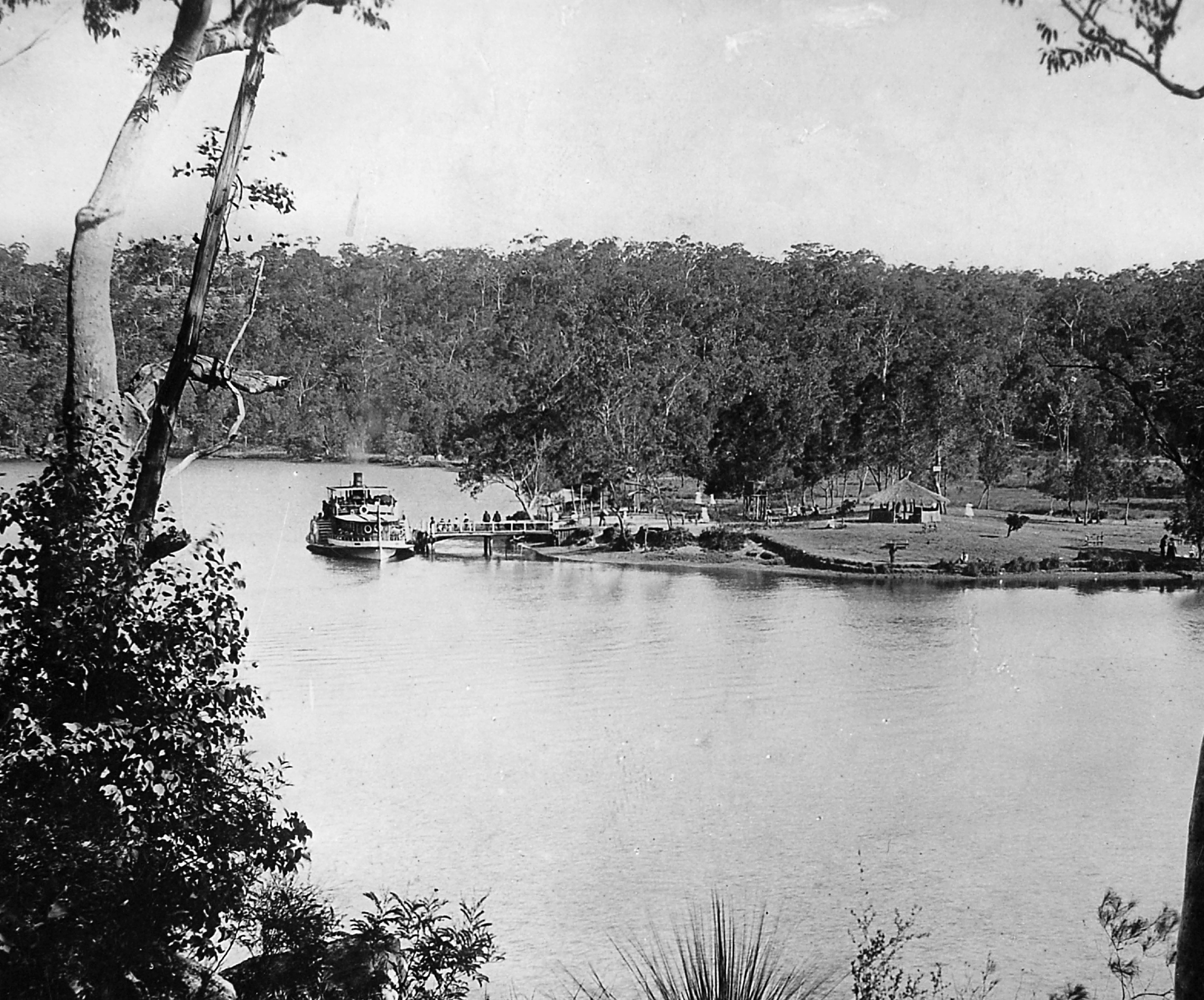 monocrome image of ferry on opposite shore to photographer
