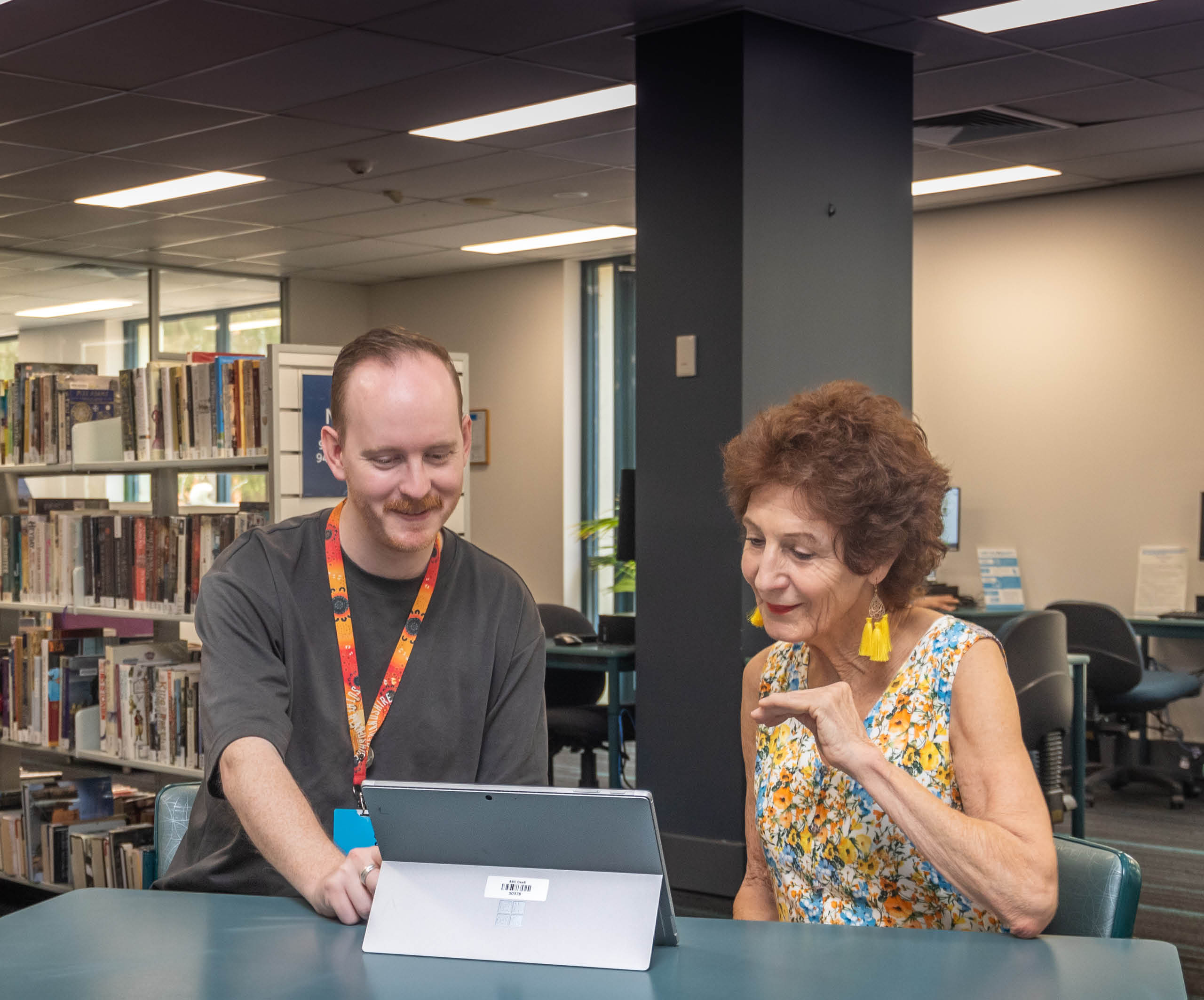 librarian helping woman on laptop at Sutherland library