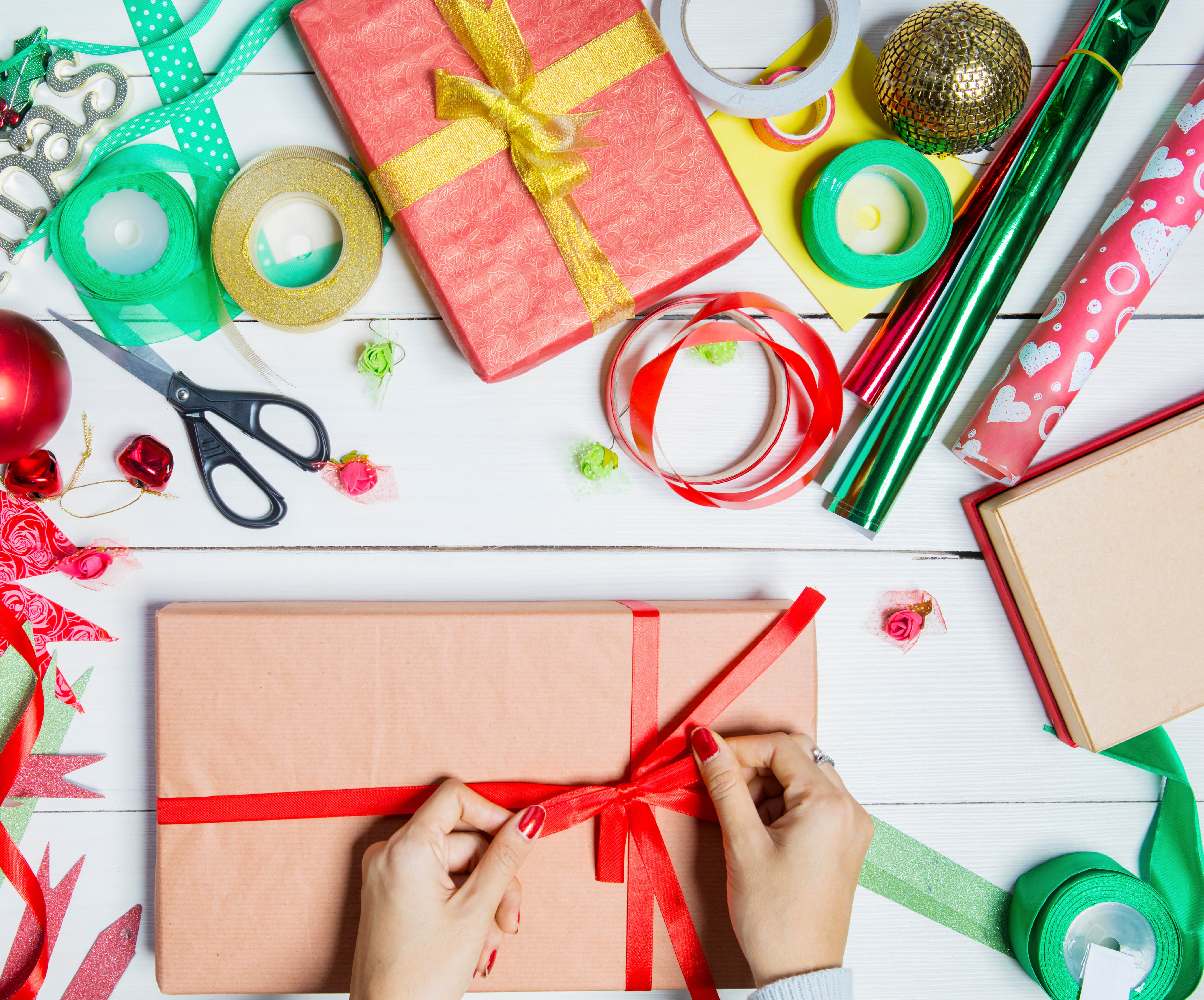 flat lay of person wrapping a gift