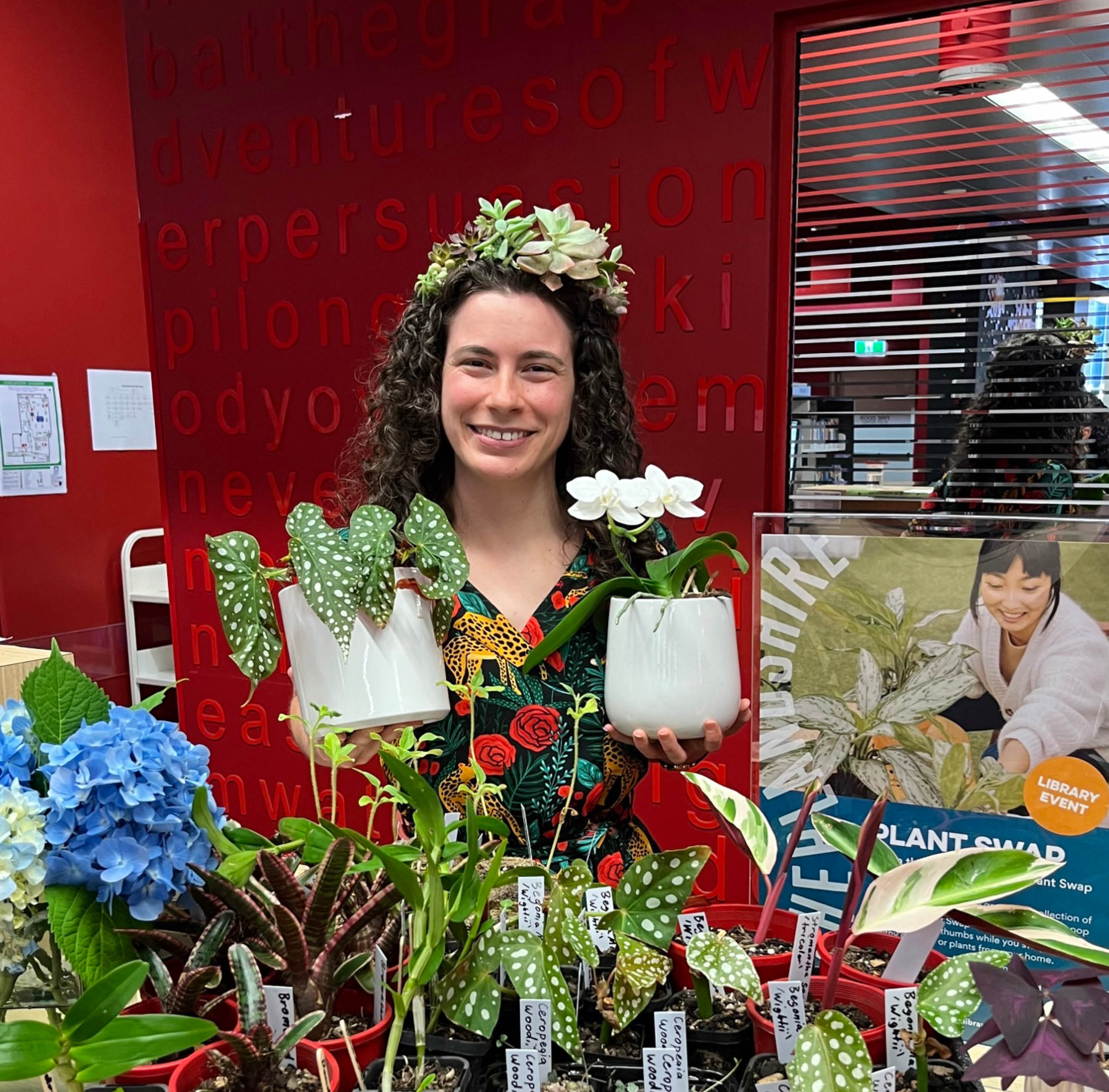 Julia holding plants at Cronulla Library