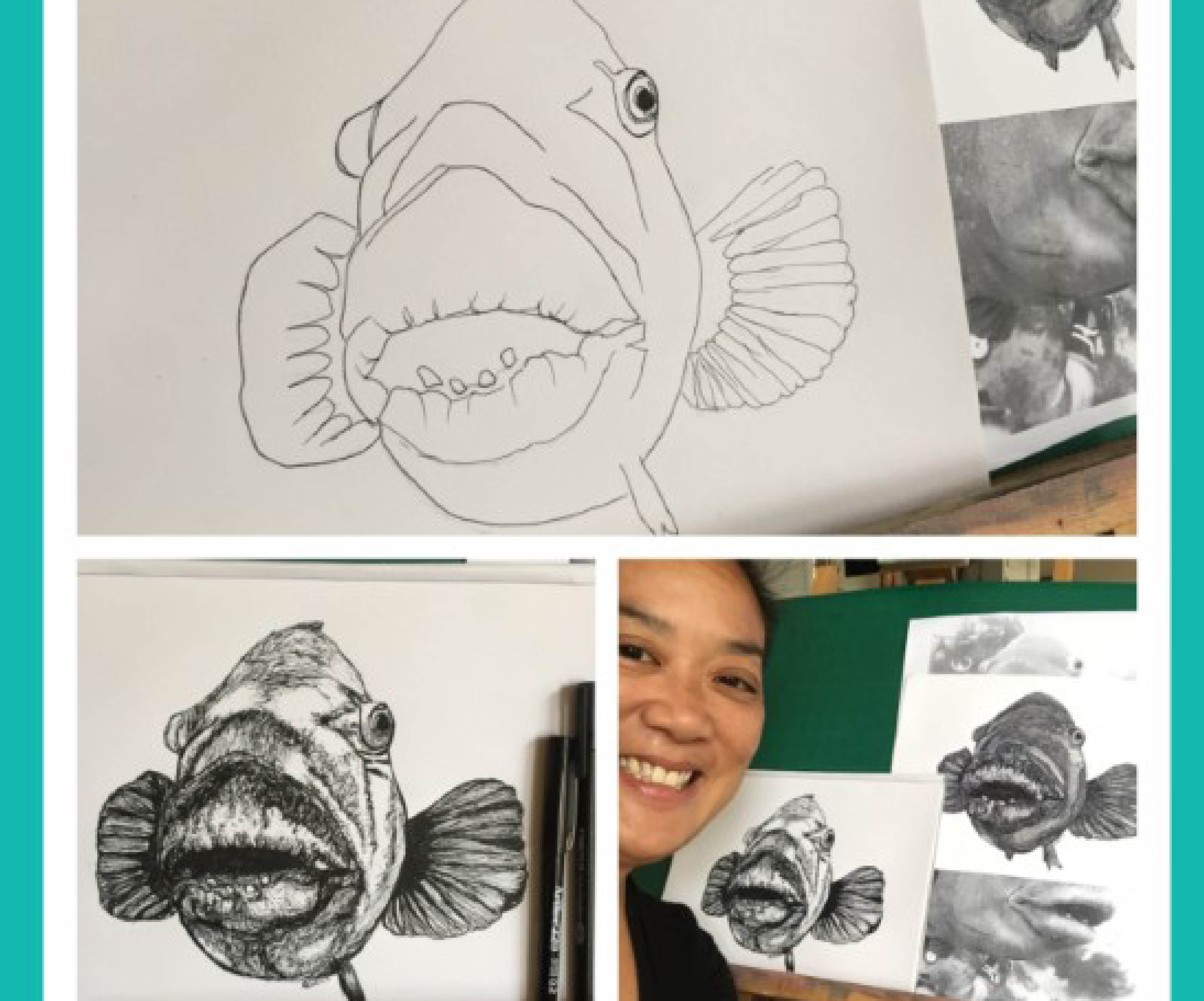 artist with marine life drawings