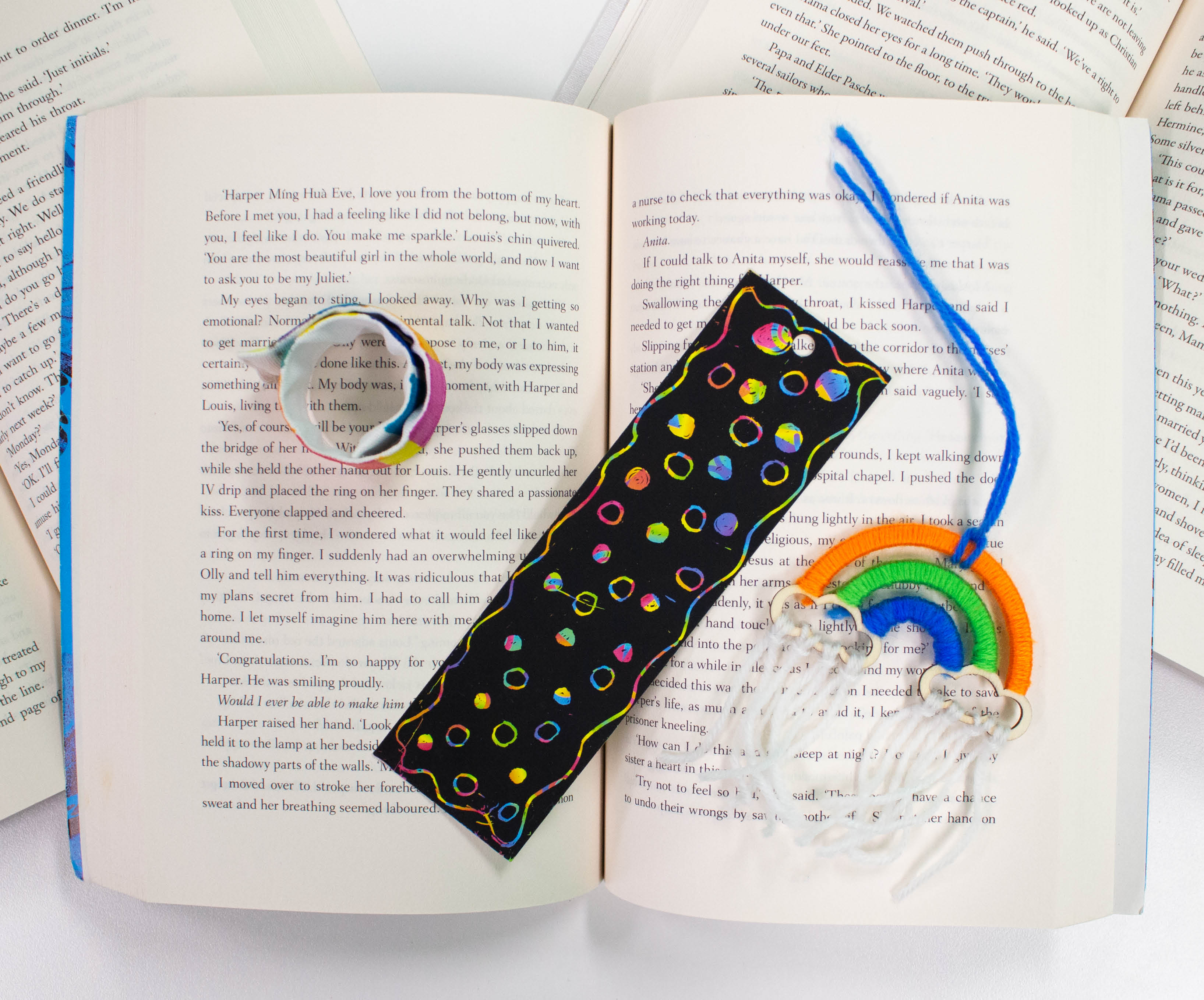 Snap band bookmark and rainbow craft on open book