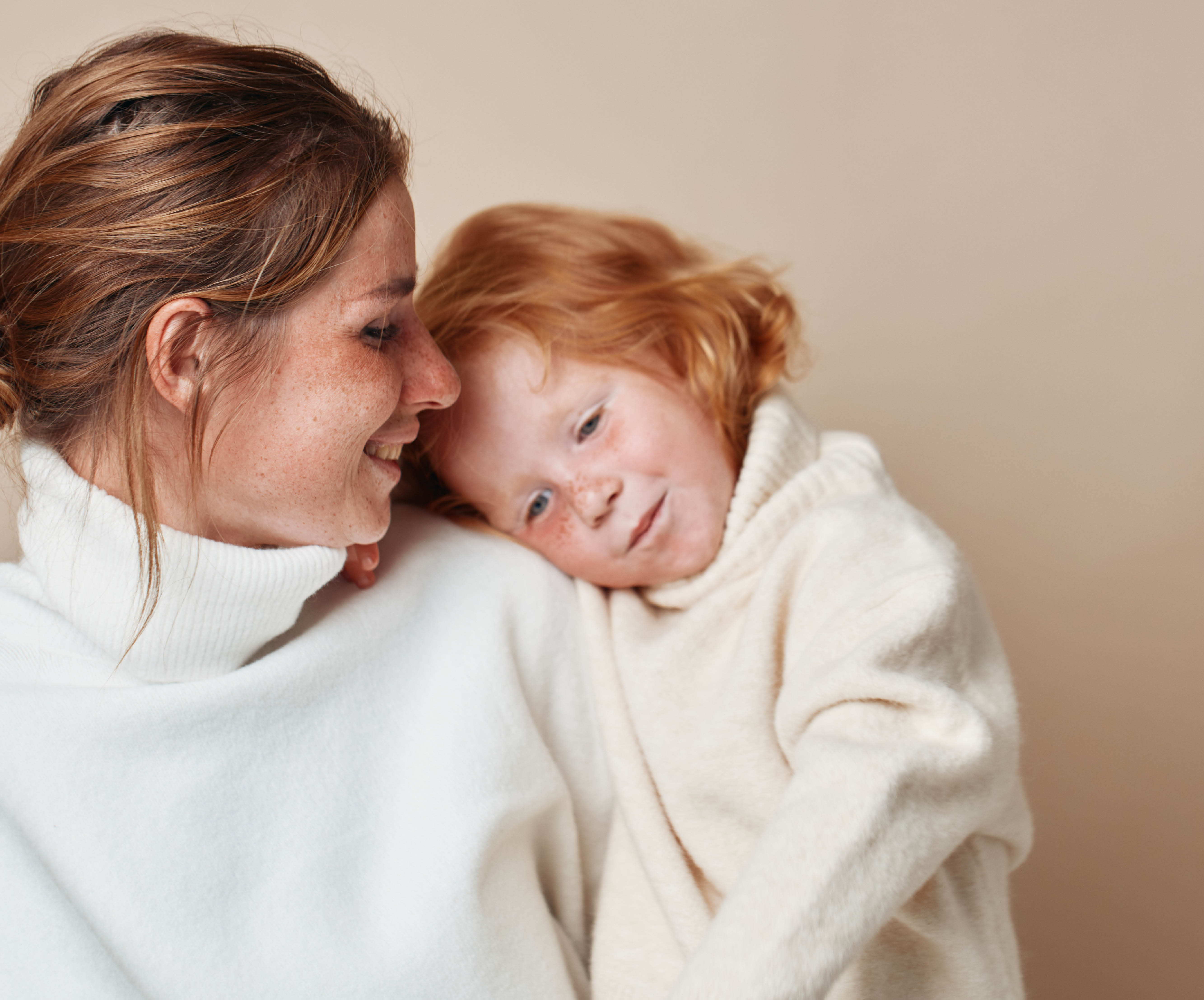 mother and child wearing white jumpers