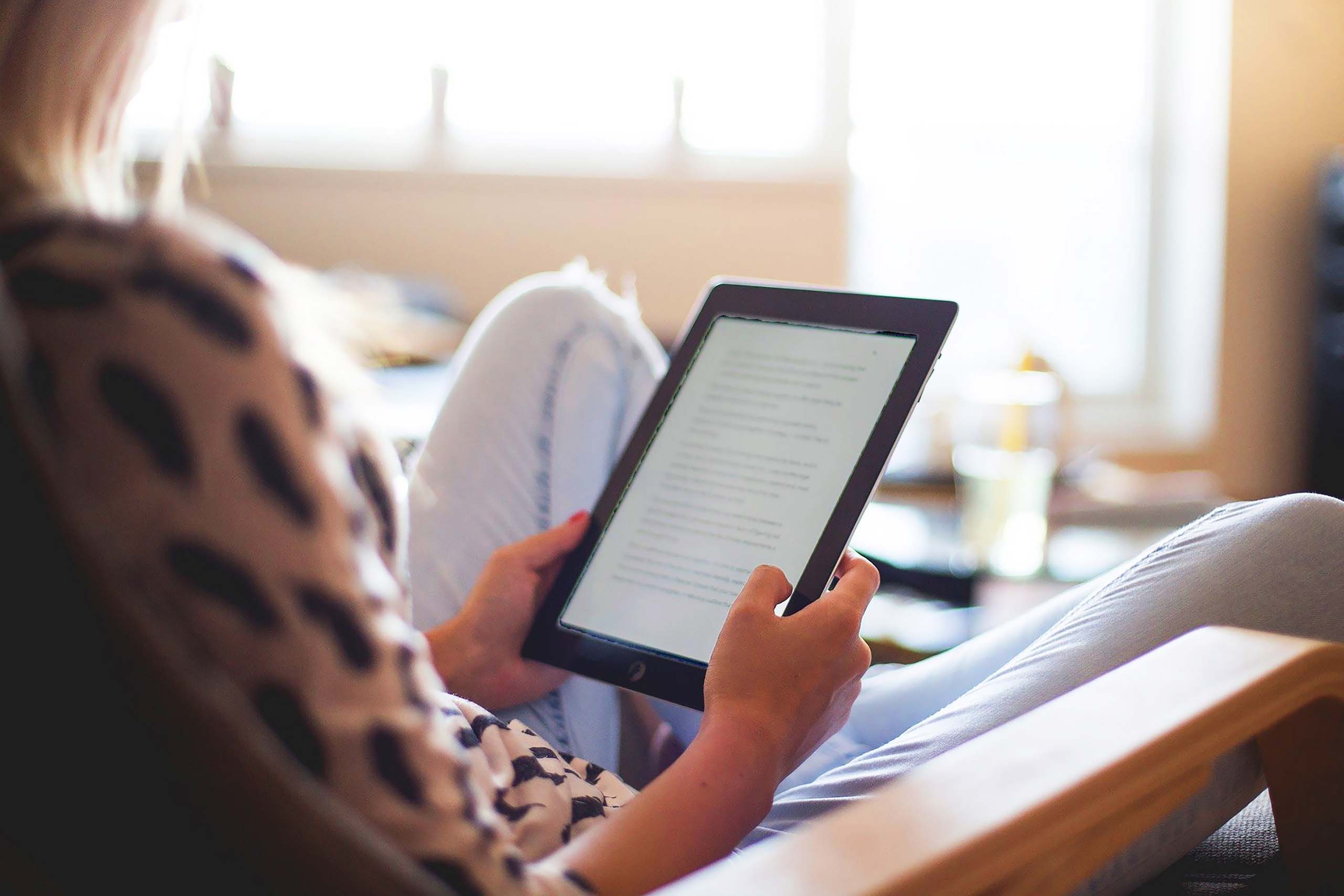 Woman reading eBook on a tablet