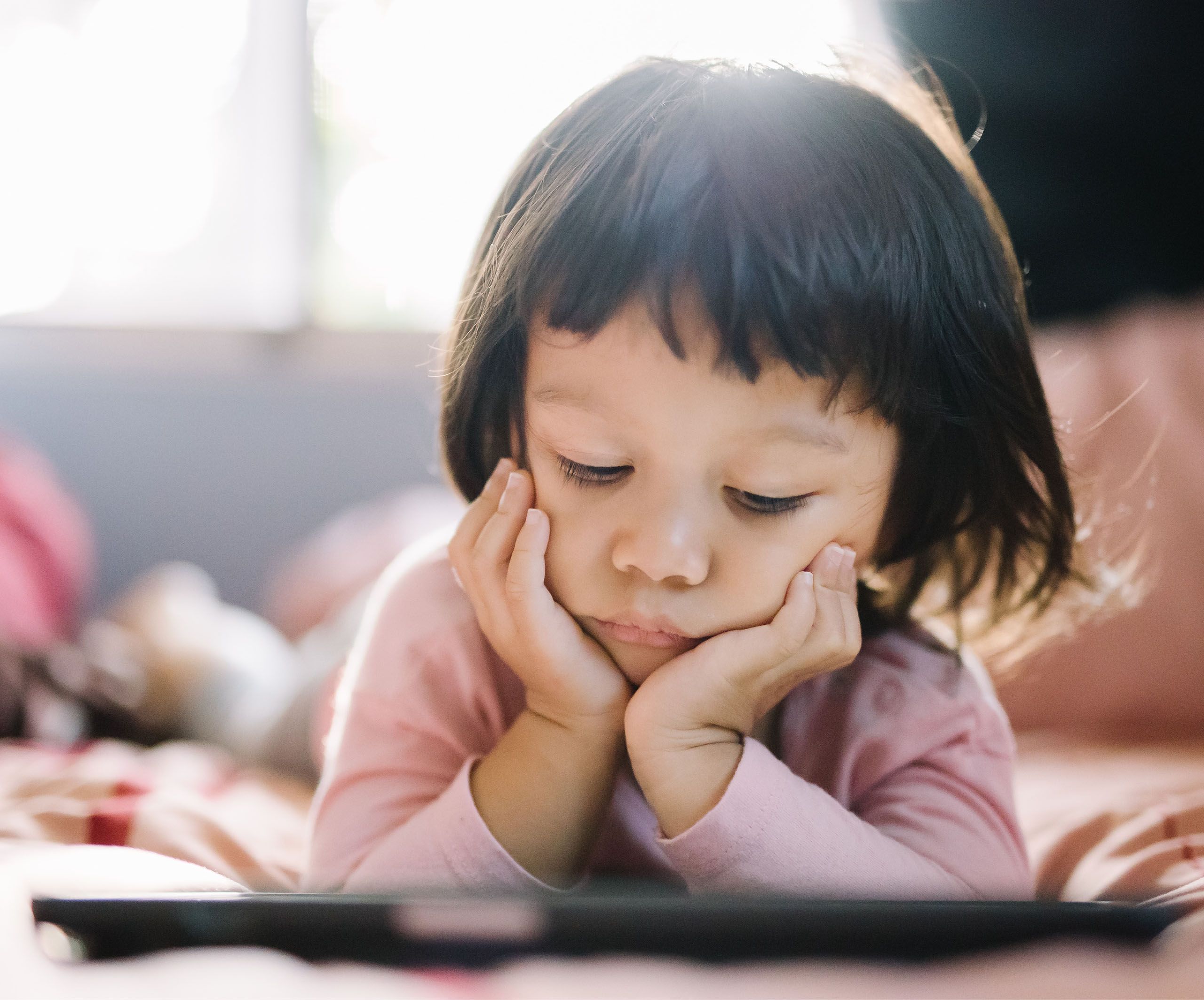 child reading from ipad 