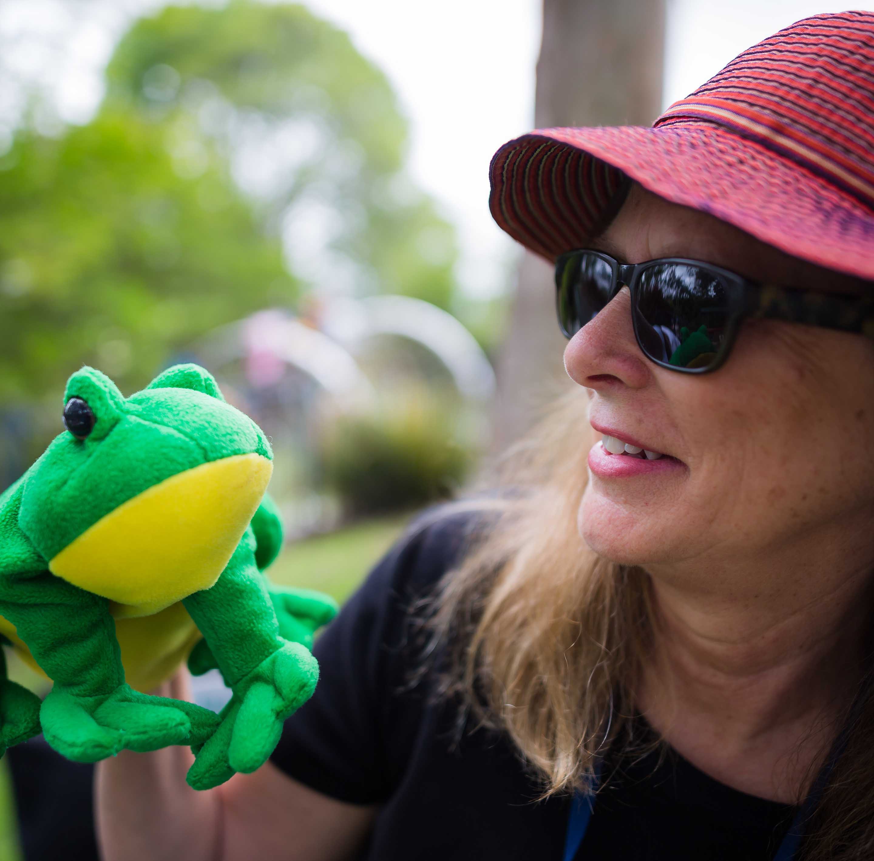 Woman with a frog puppet